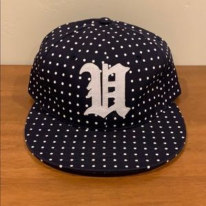 Undefeated flat brim hat with leather strap